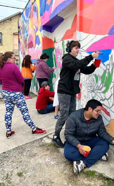 students painting in may